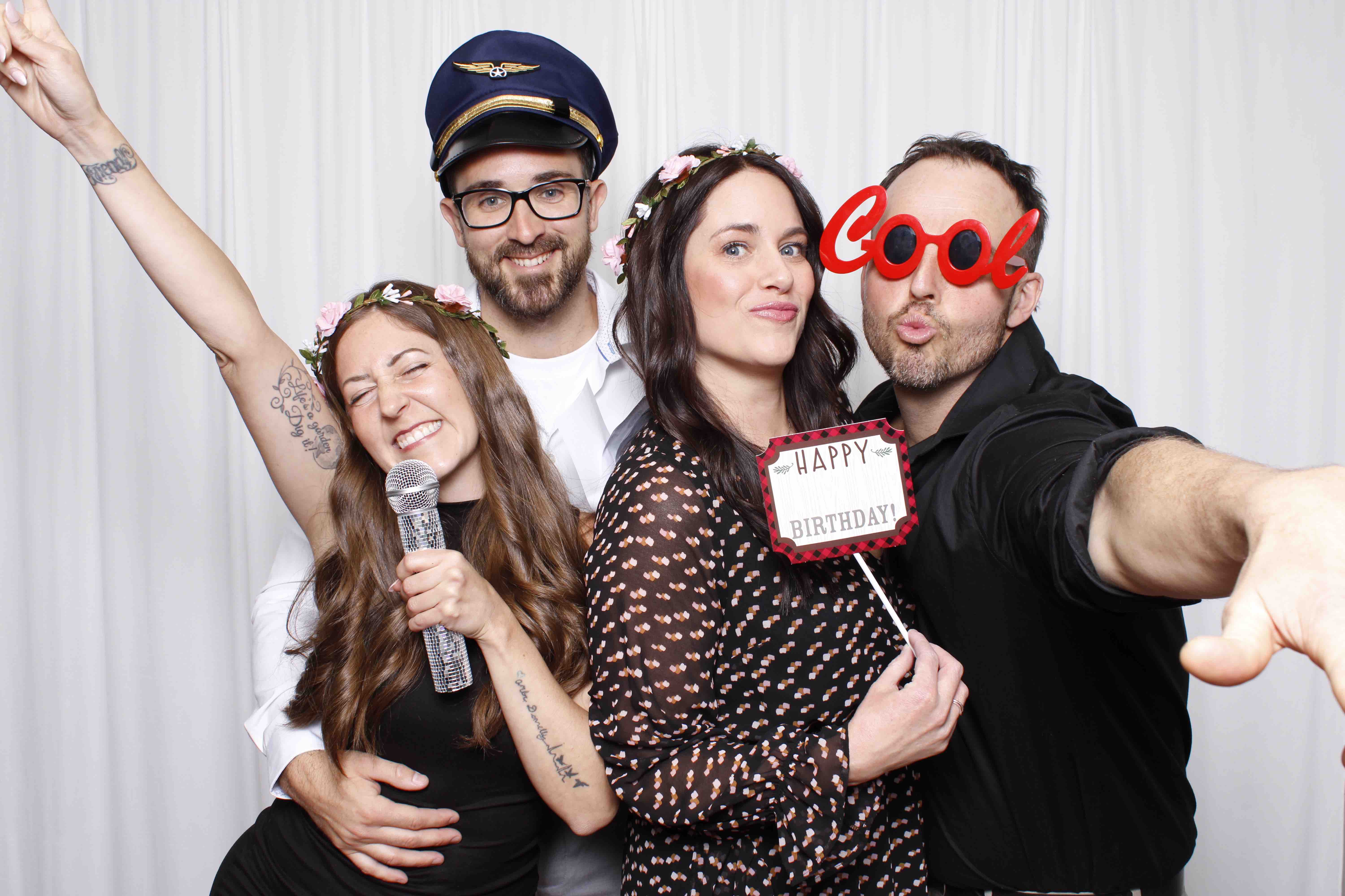 Friends enjoying an event photo booth