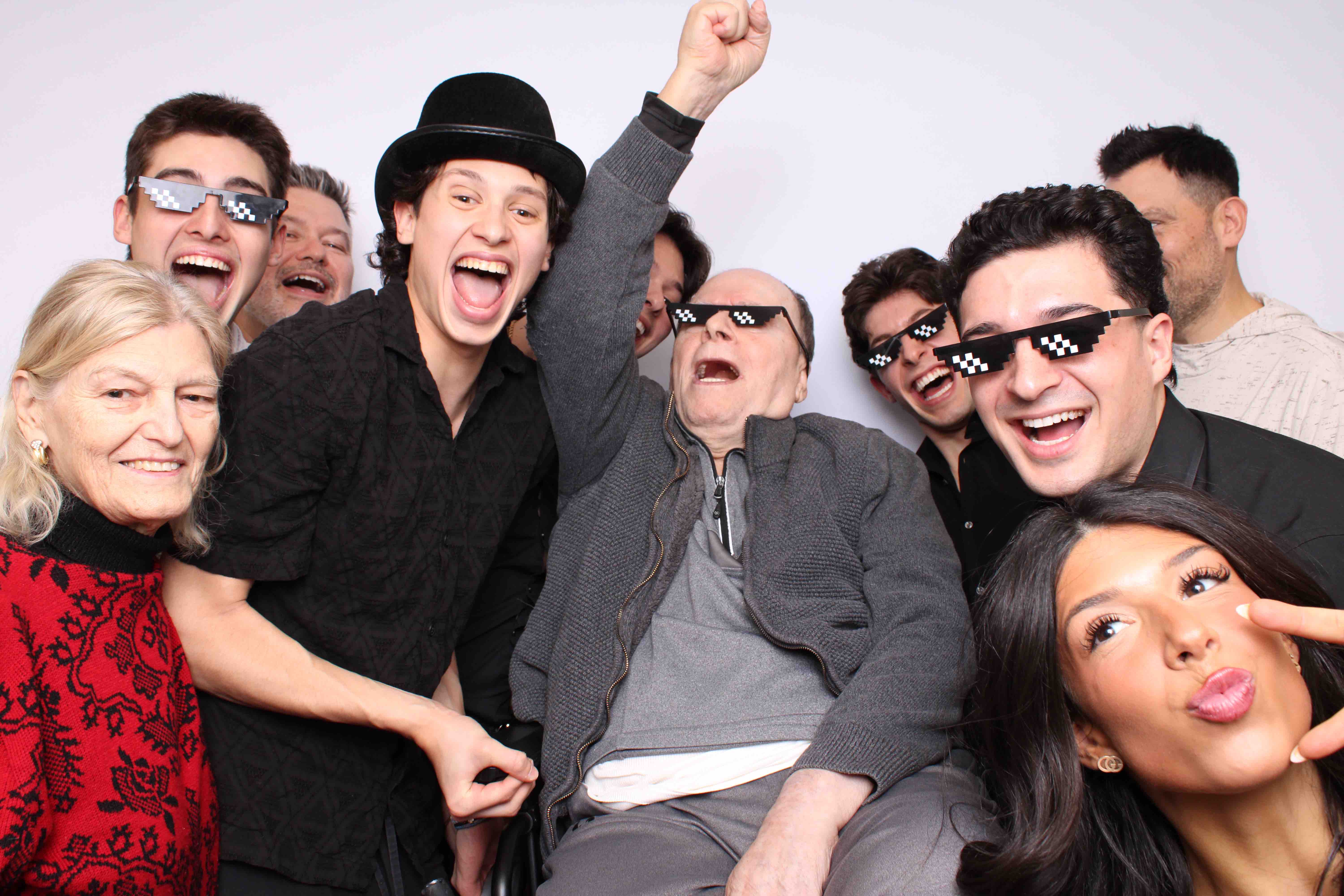 Family taking a festive photo booth picture