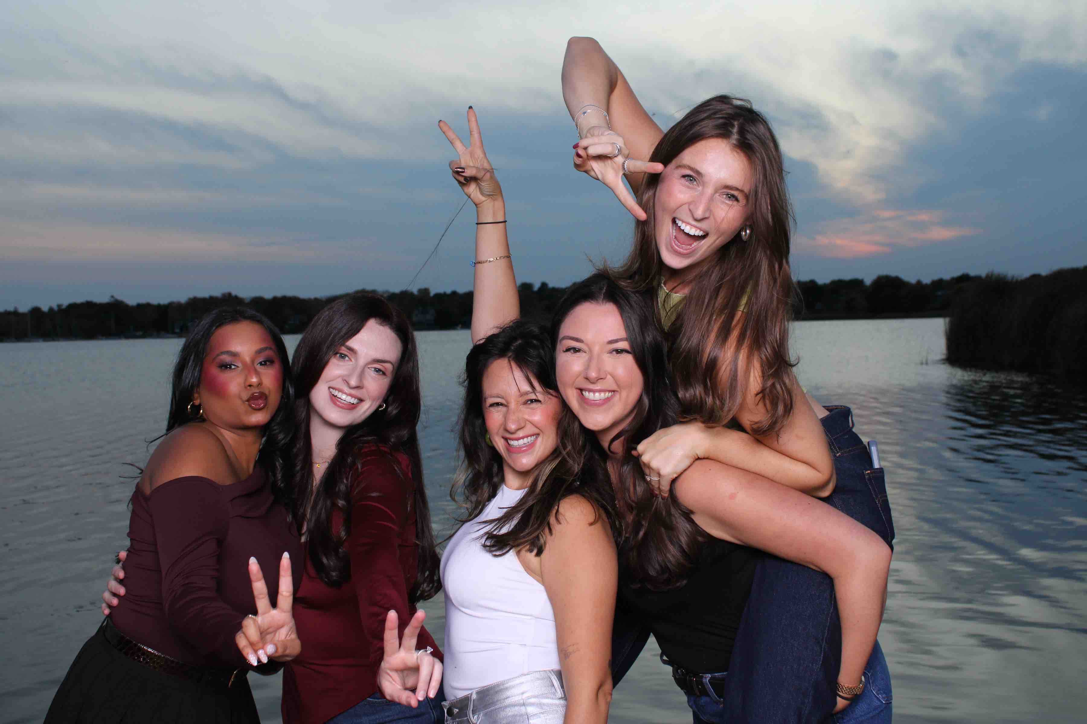 Outdoor event photo booth moment by the water