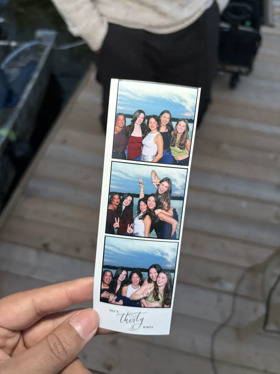 Guests receiving instant prints from a photo booth.